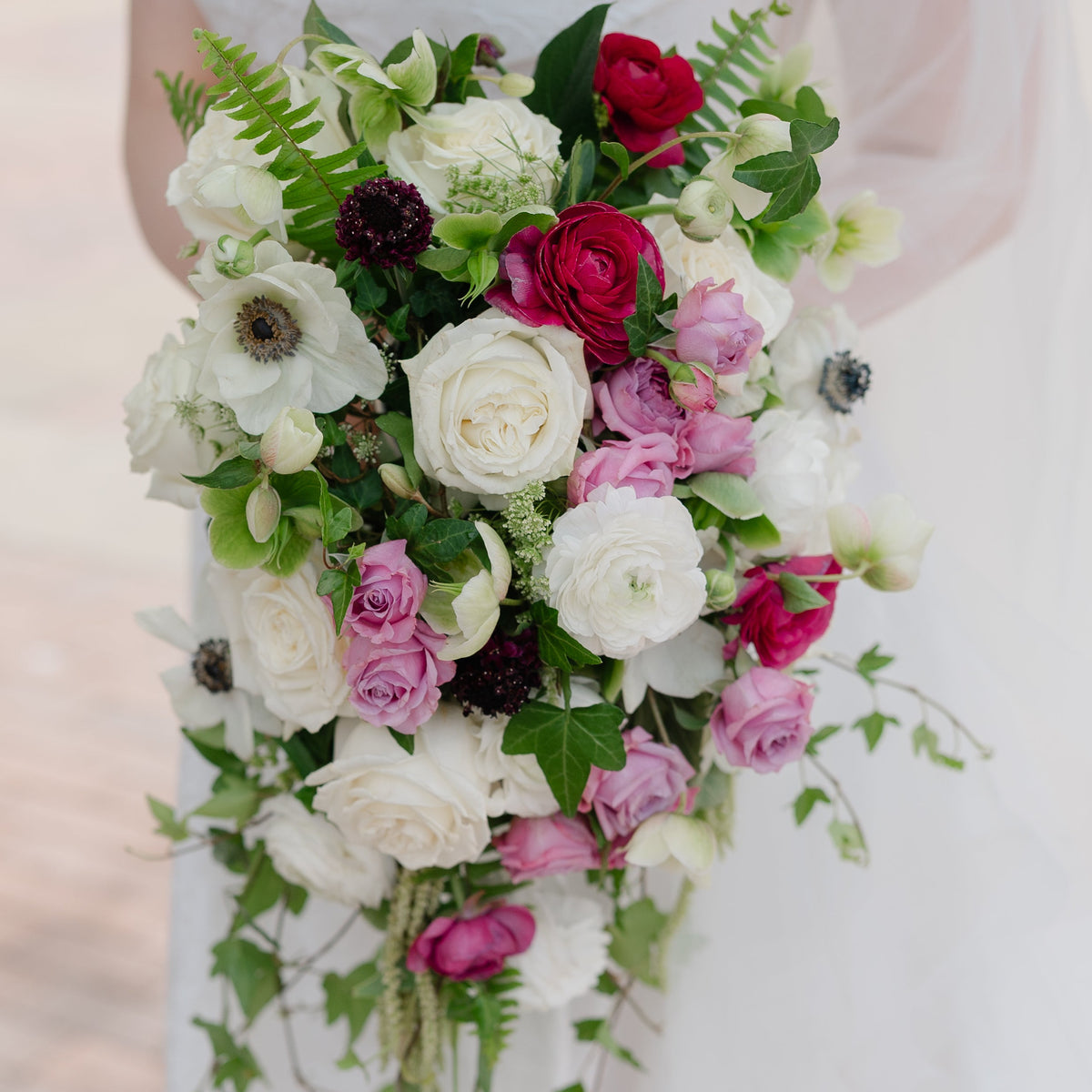 Cascading bridal bouquet with white, pink, and green flowers, Pella, Iowa
